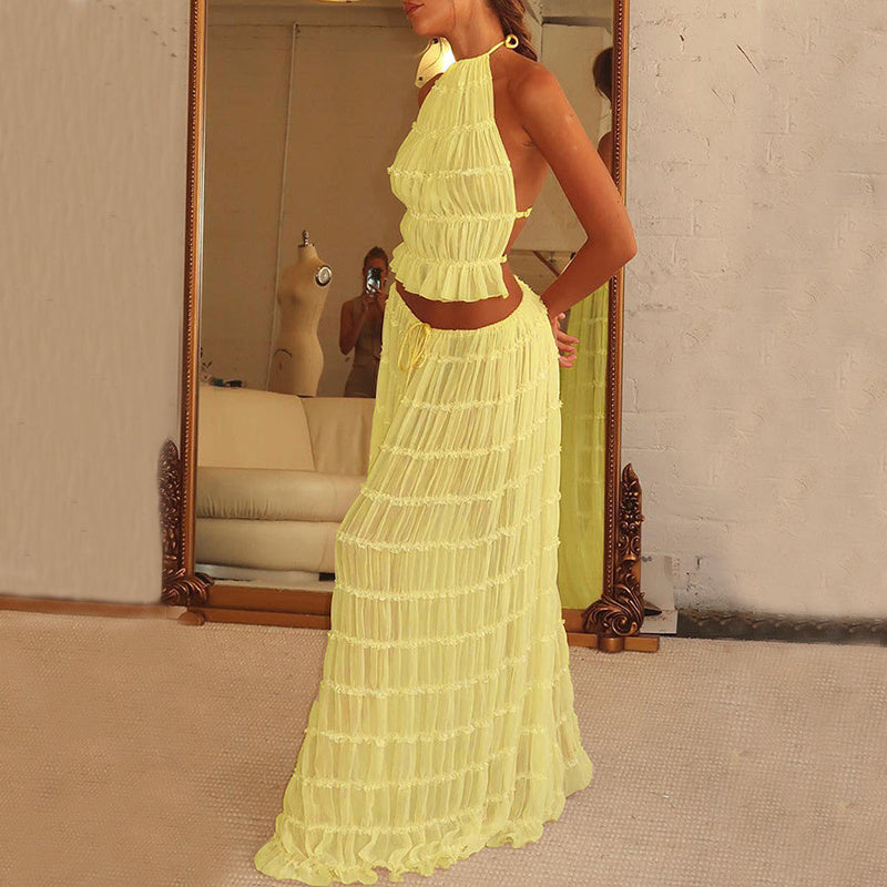 Isla – 2-delige gele damesoutfit met haltertop en geplooide rok