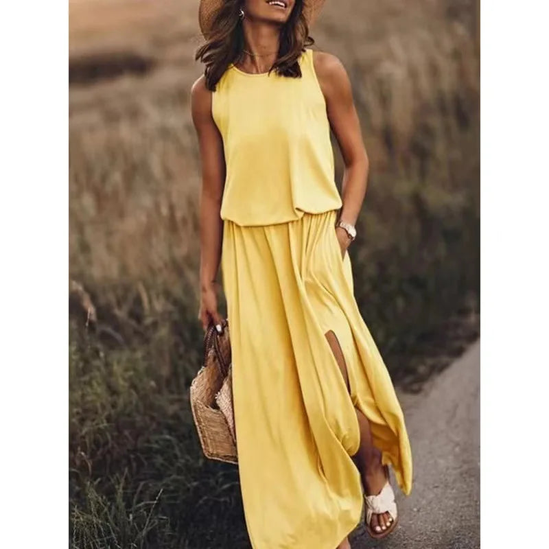 Gele effen jurk met O-hals en kwastjes, perfect voor de zomer.