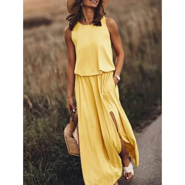 Gele effen jurk met O-hals en kwastjes, perfect voor de zomer.