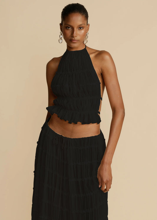 Isla – zwarte 2-delige damesoutfit met haltertop en geplooide rok